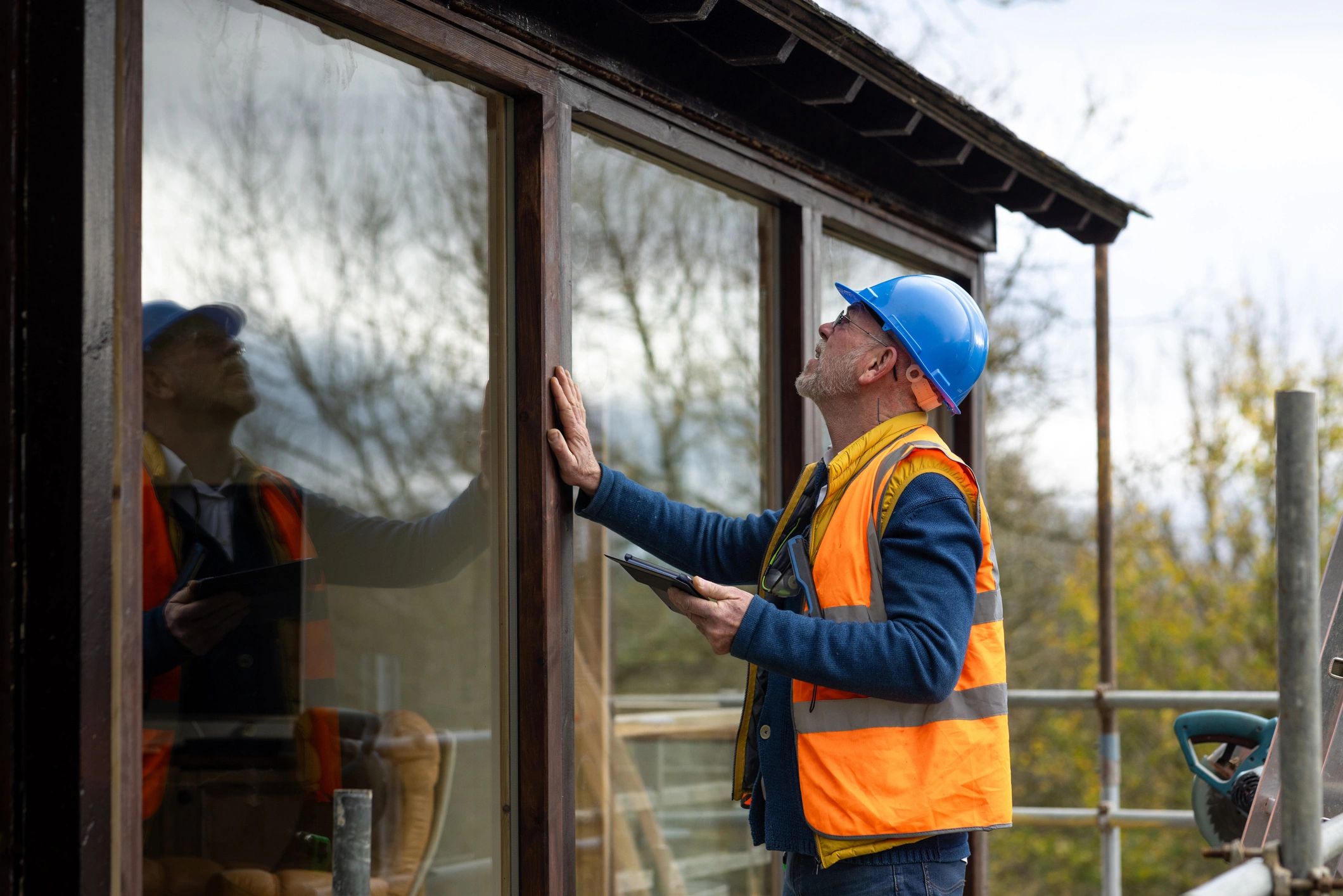Technician inspecting and testing a newly installed security system
