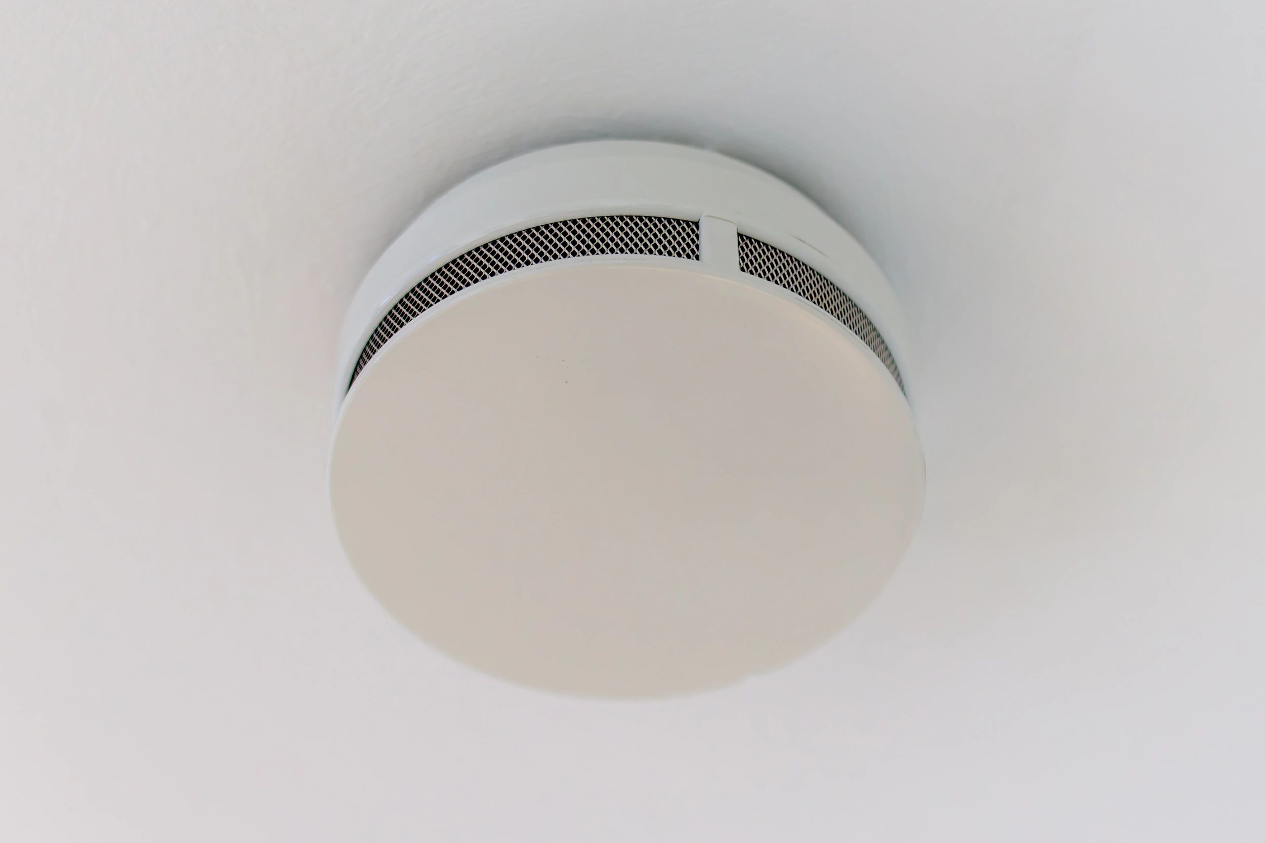 Ceiling-mounted detector in a residential interior